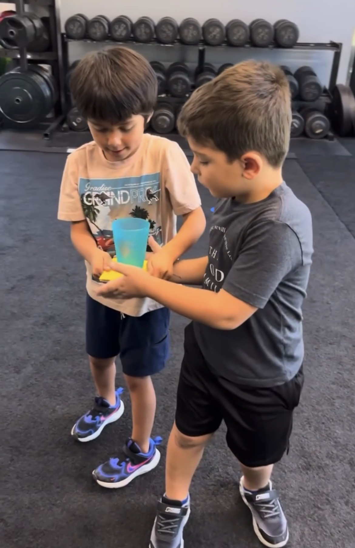 Two boys working together on balance challenge at Power Play PE Sacramento