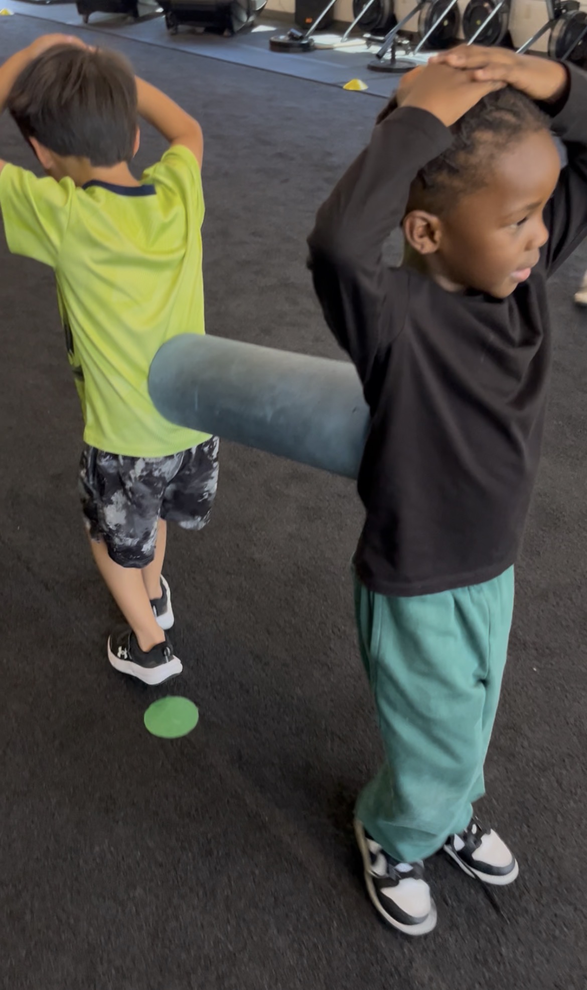 Two boys doing movement together at Little Movers PE class Sacramento