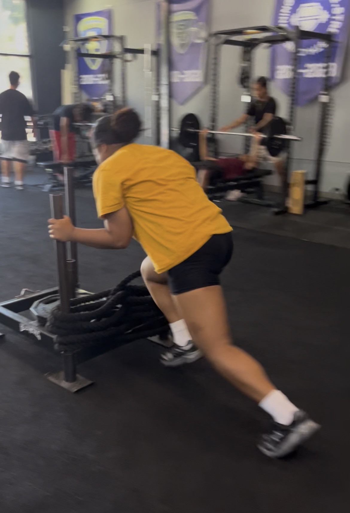 Teen pushing sled at ISC Sacramento youth class