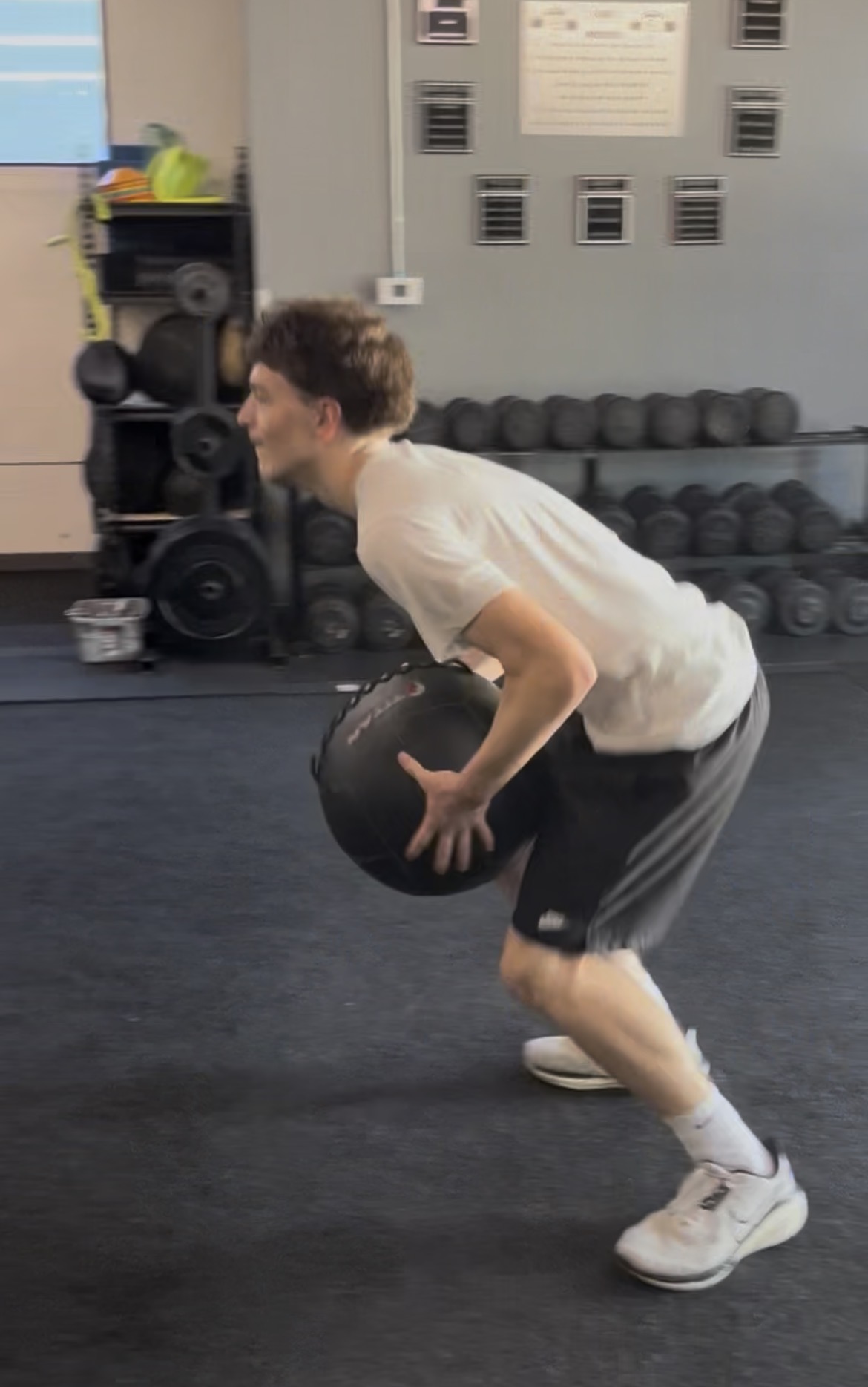 Teen boy with medicine ball at ISC gym Sacramento