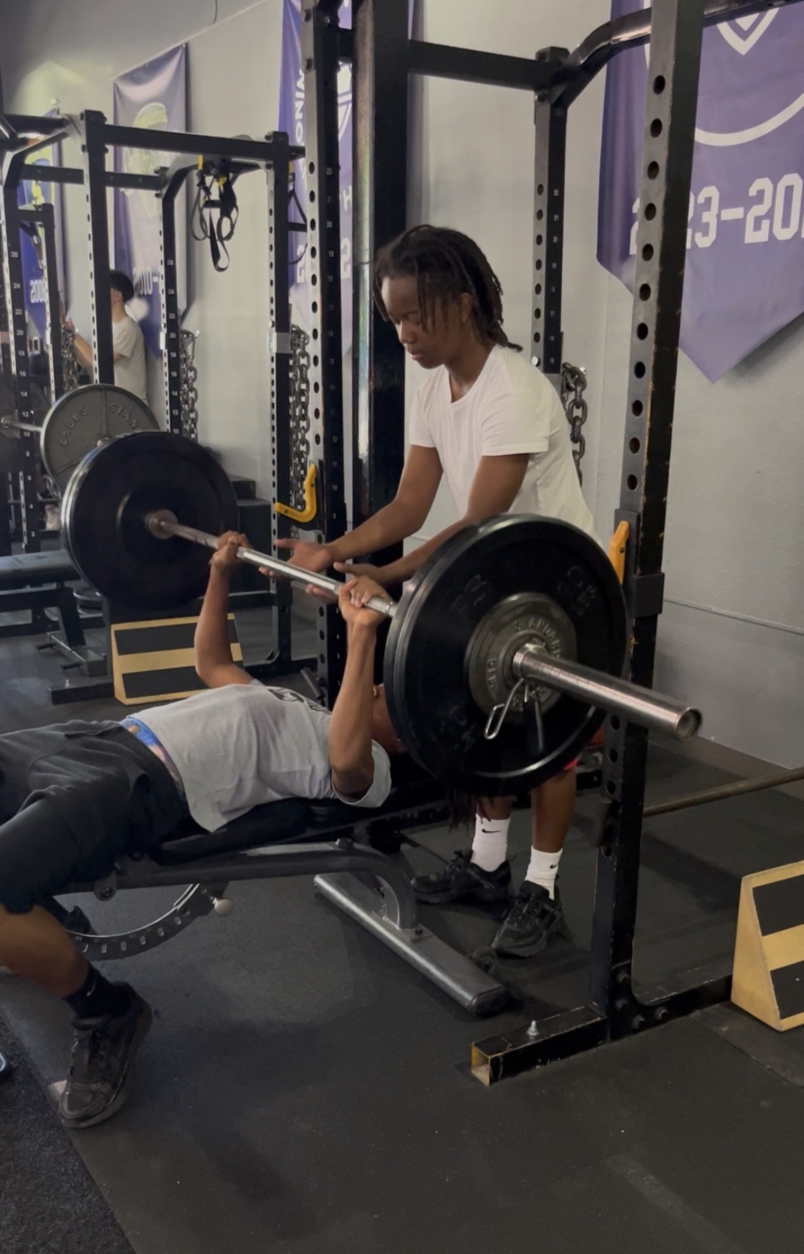 Teens learning to spot bench press at ISC Sacramento