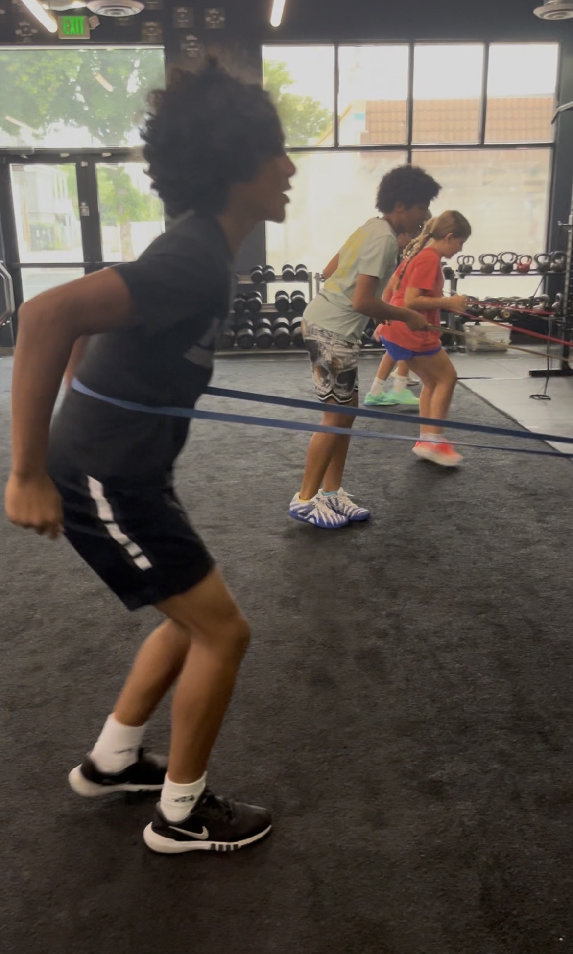 Teens using resistance bands at Power Play PE Sacramento