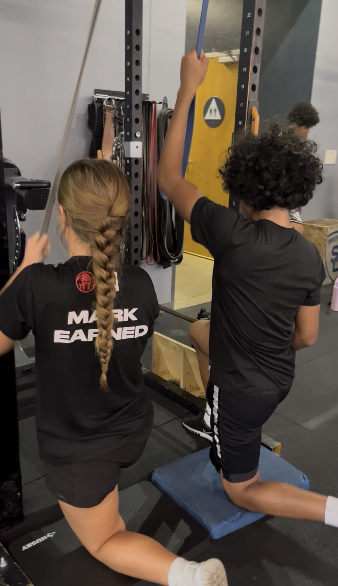 Teens doing cable pull exercise at Power Play PE Sacramento