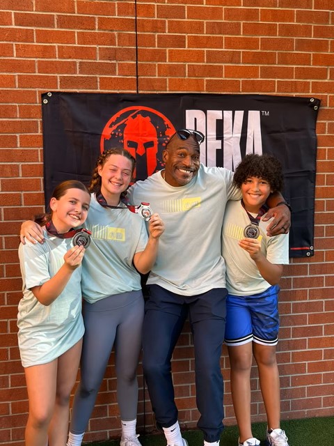 Youth athletes with their DEKA finisher medals at ISC Sacramento