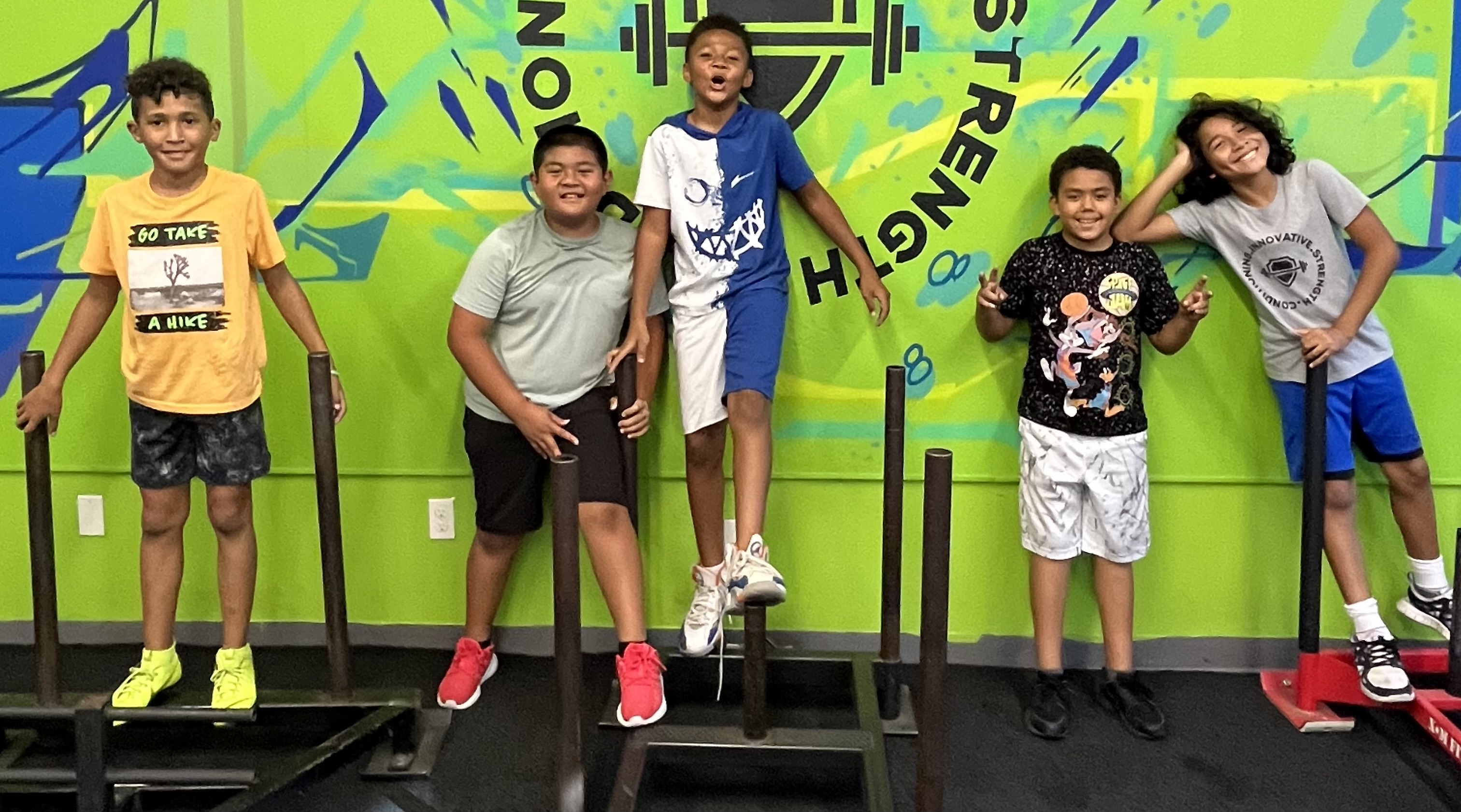 Kids jumping and playing during homeschool PE class at Sacramento gym