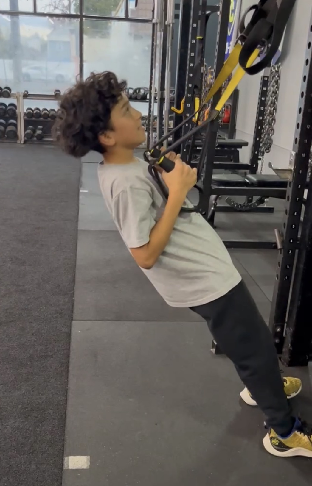 Homeschool teen doing TRX rows at Power Play PE in Sacramento